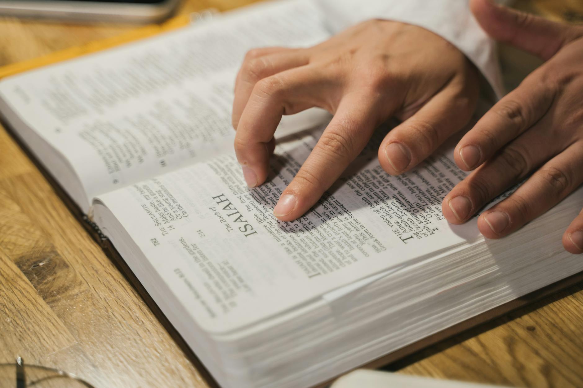 person reading a holy bible